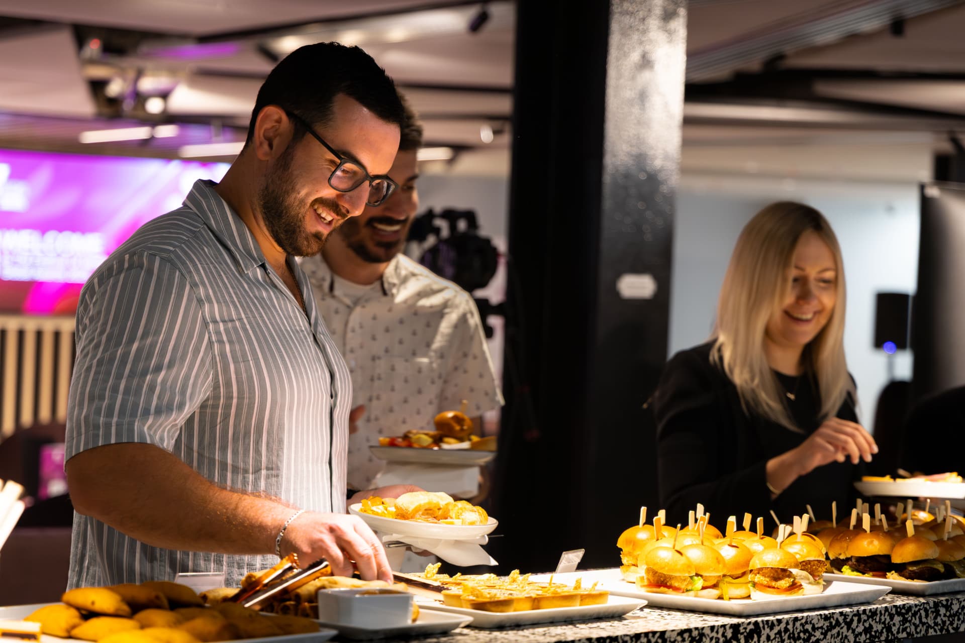 Guests serving food at the buffet