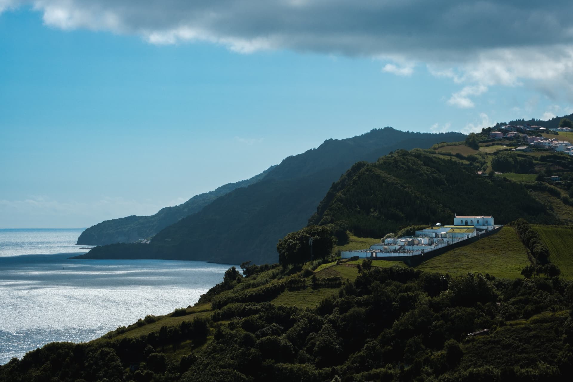 Coastal hills and white buildings overlooking the ocean