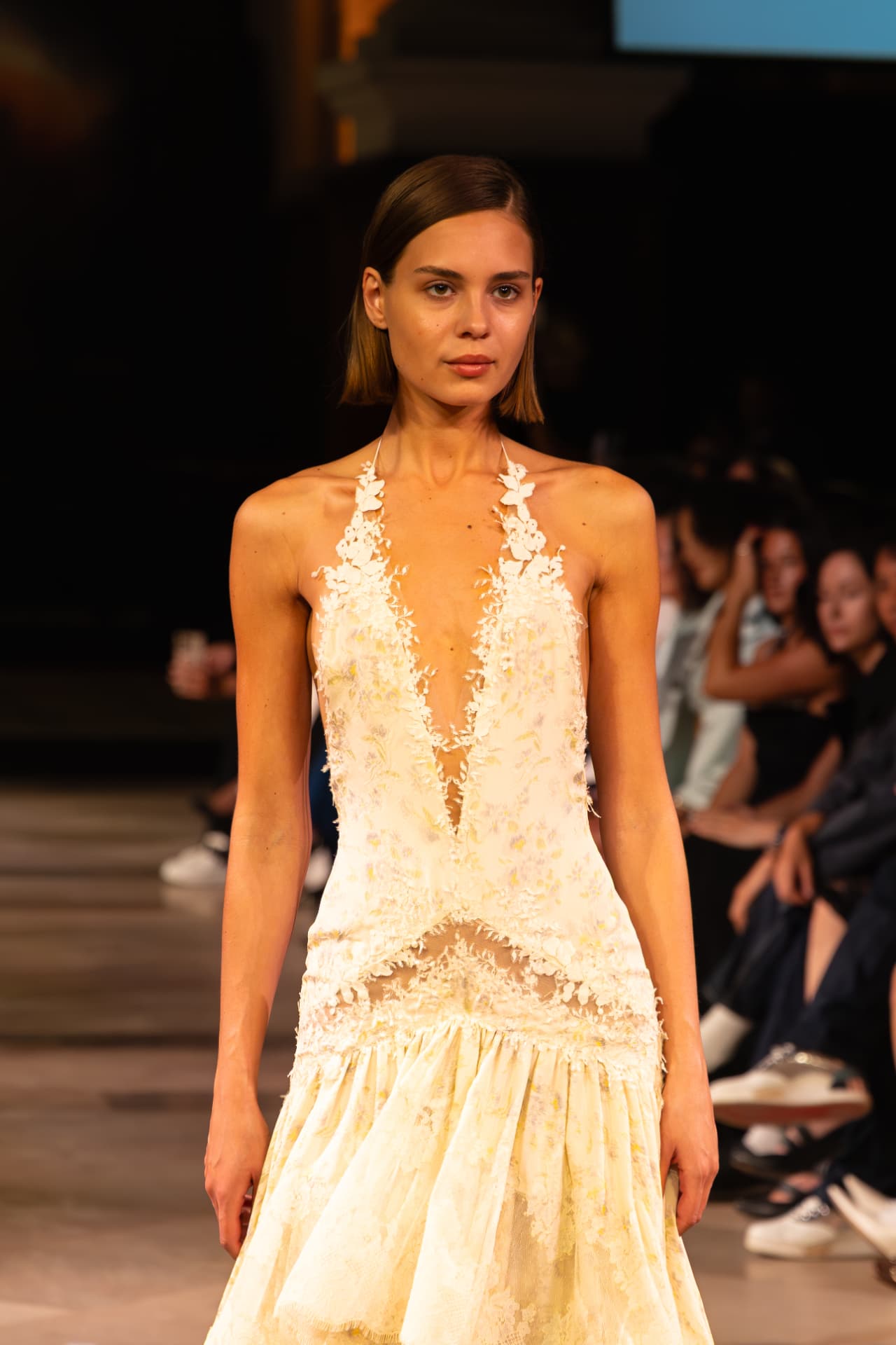 Close-up of a floral appliqué halter gown