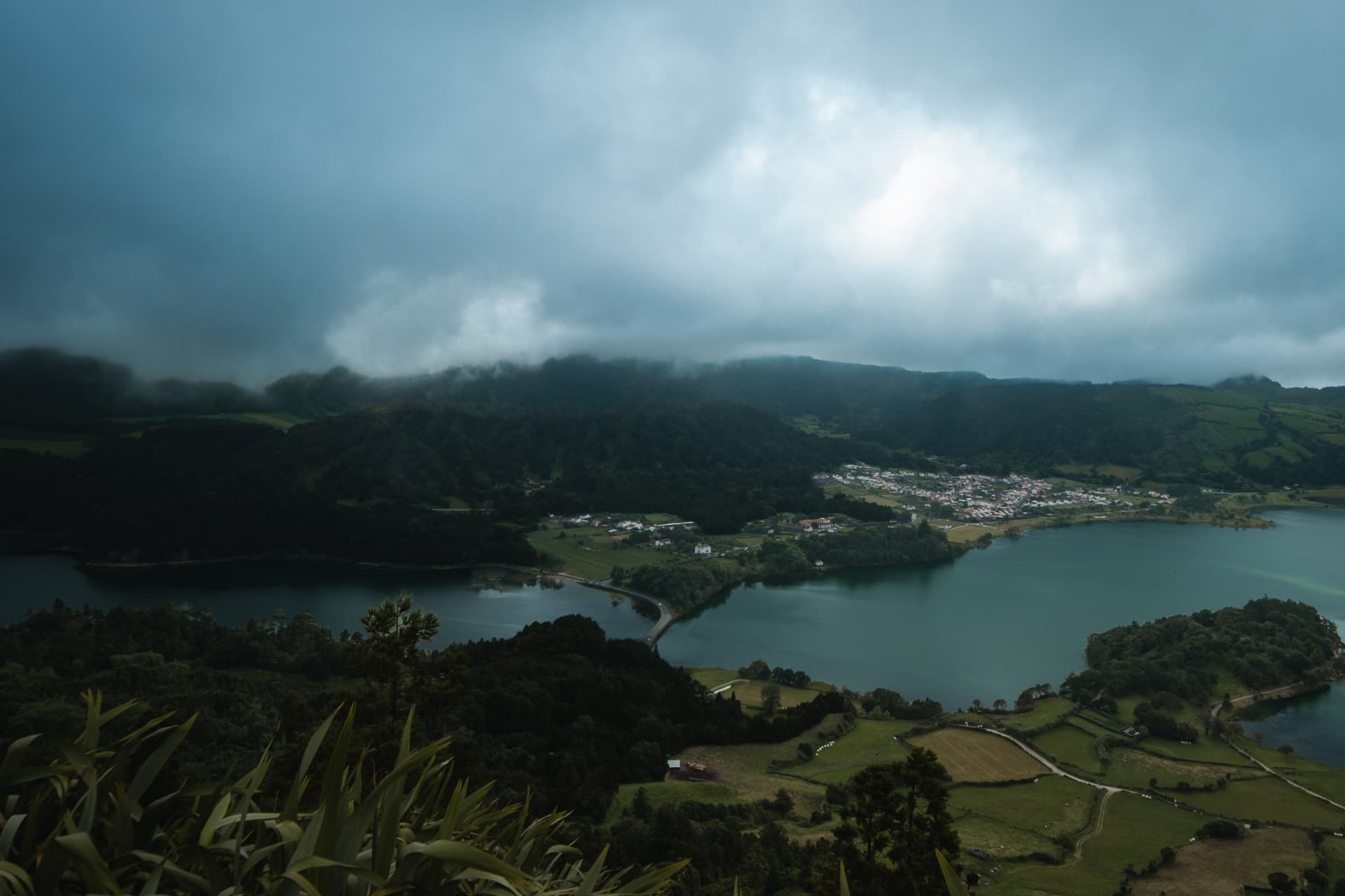 Aerial view of twin lakes beneath moody clouds