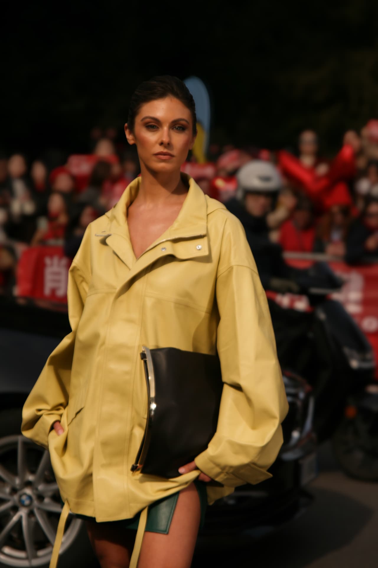 Guest in an oversized pale yellow leather jacket