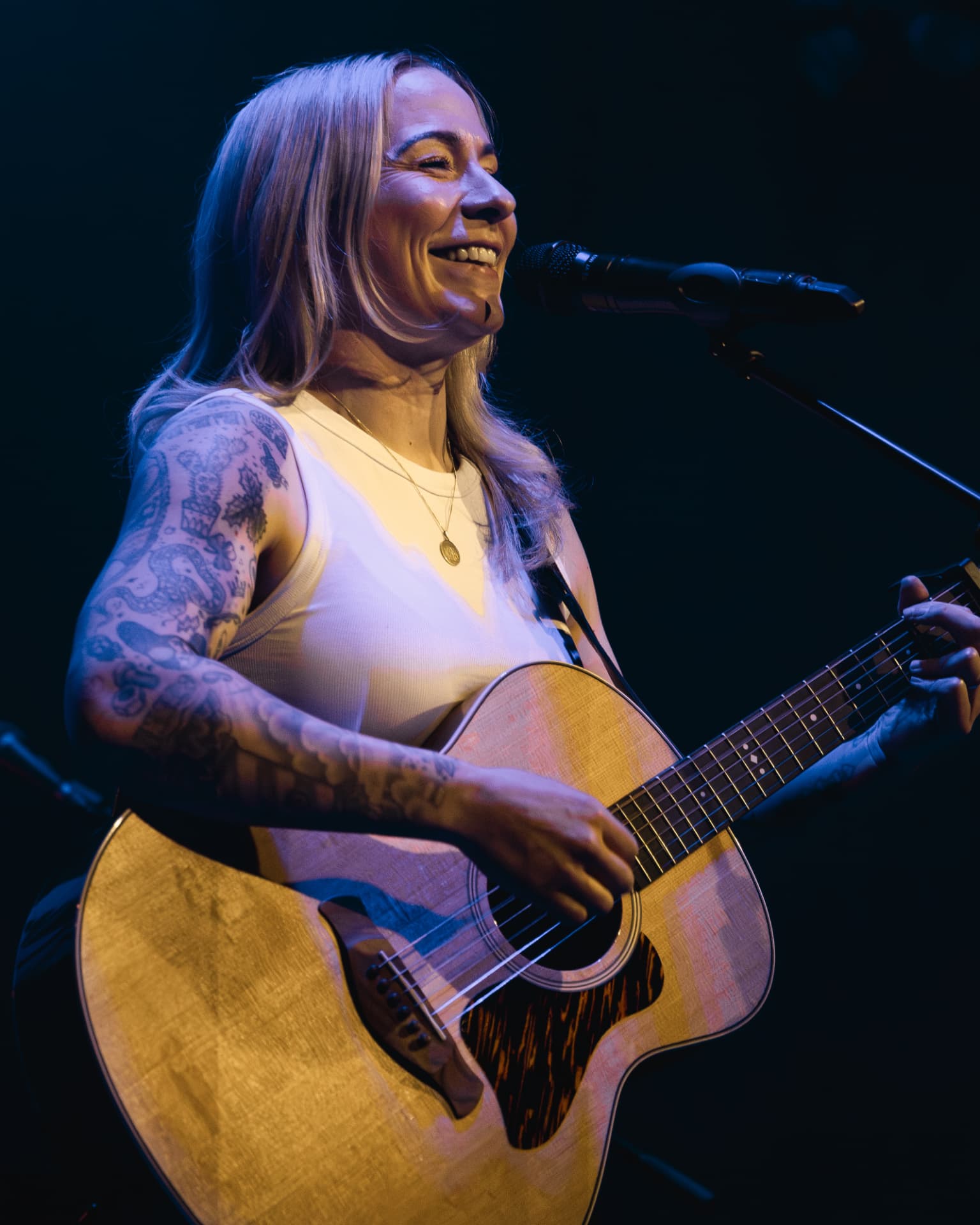Close portrait smiling at the microphone