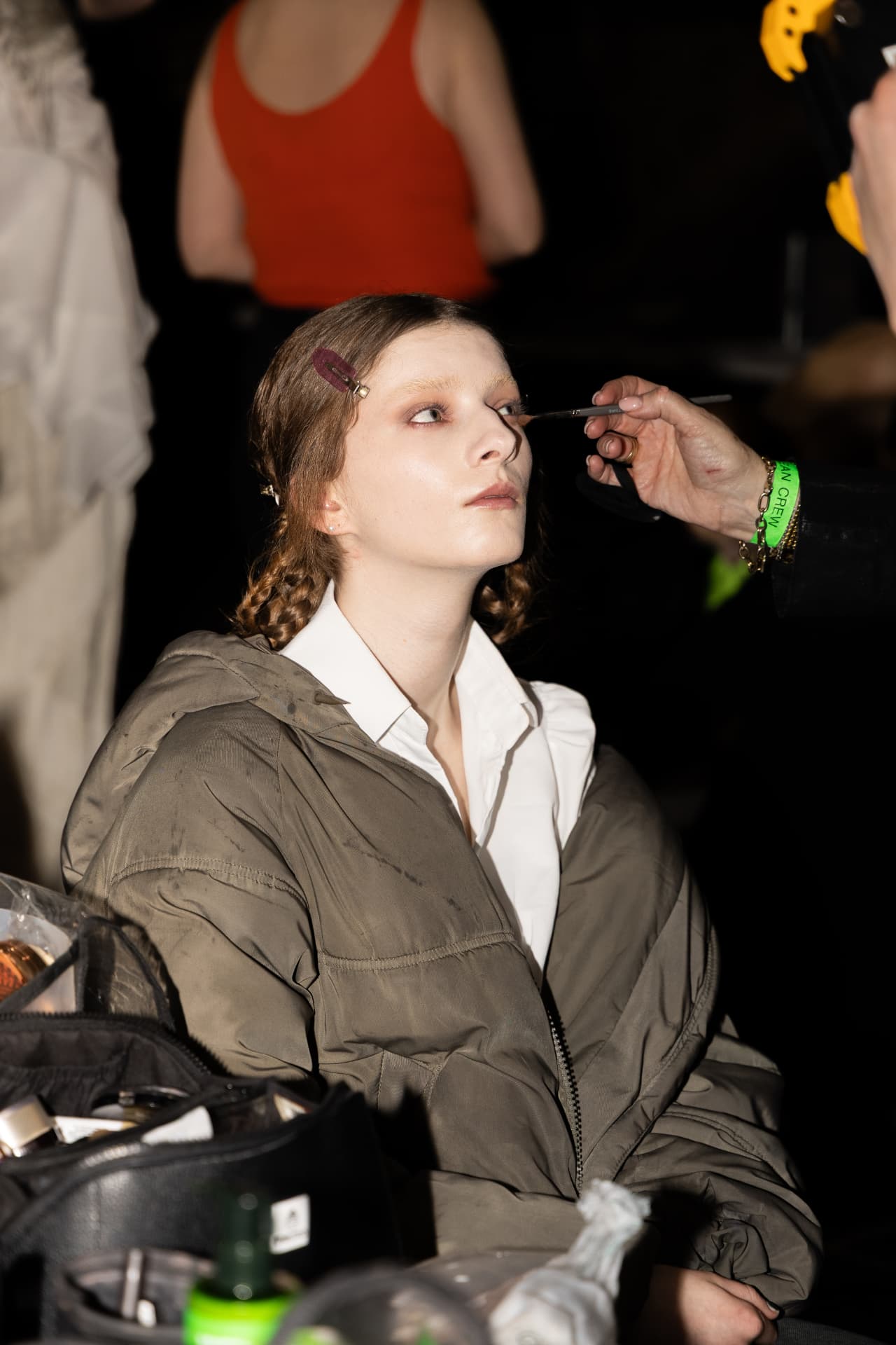 Makeup being applied to a model backstage