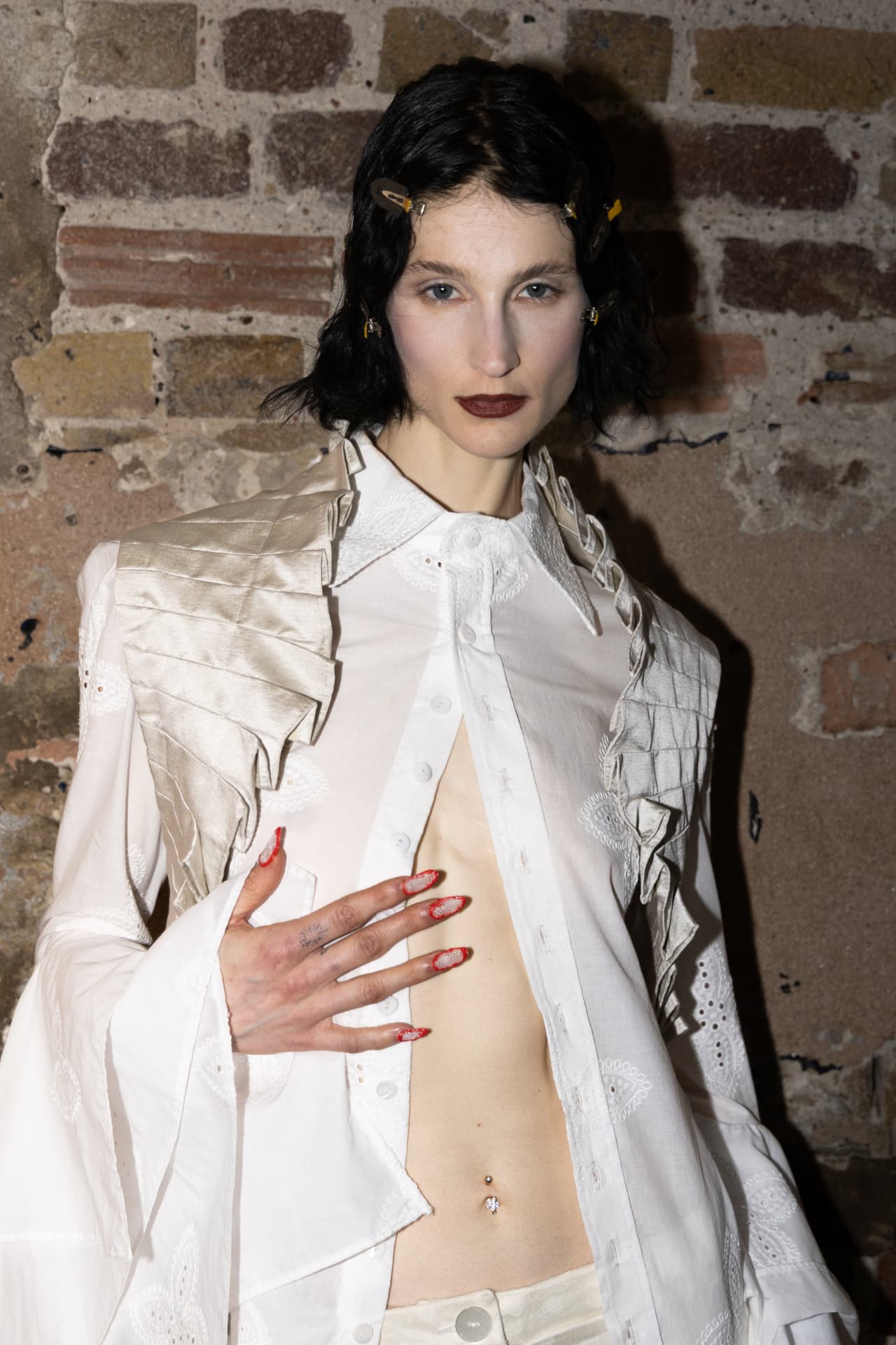 Model in white embroidered shirting look