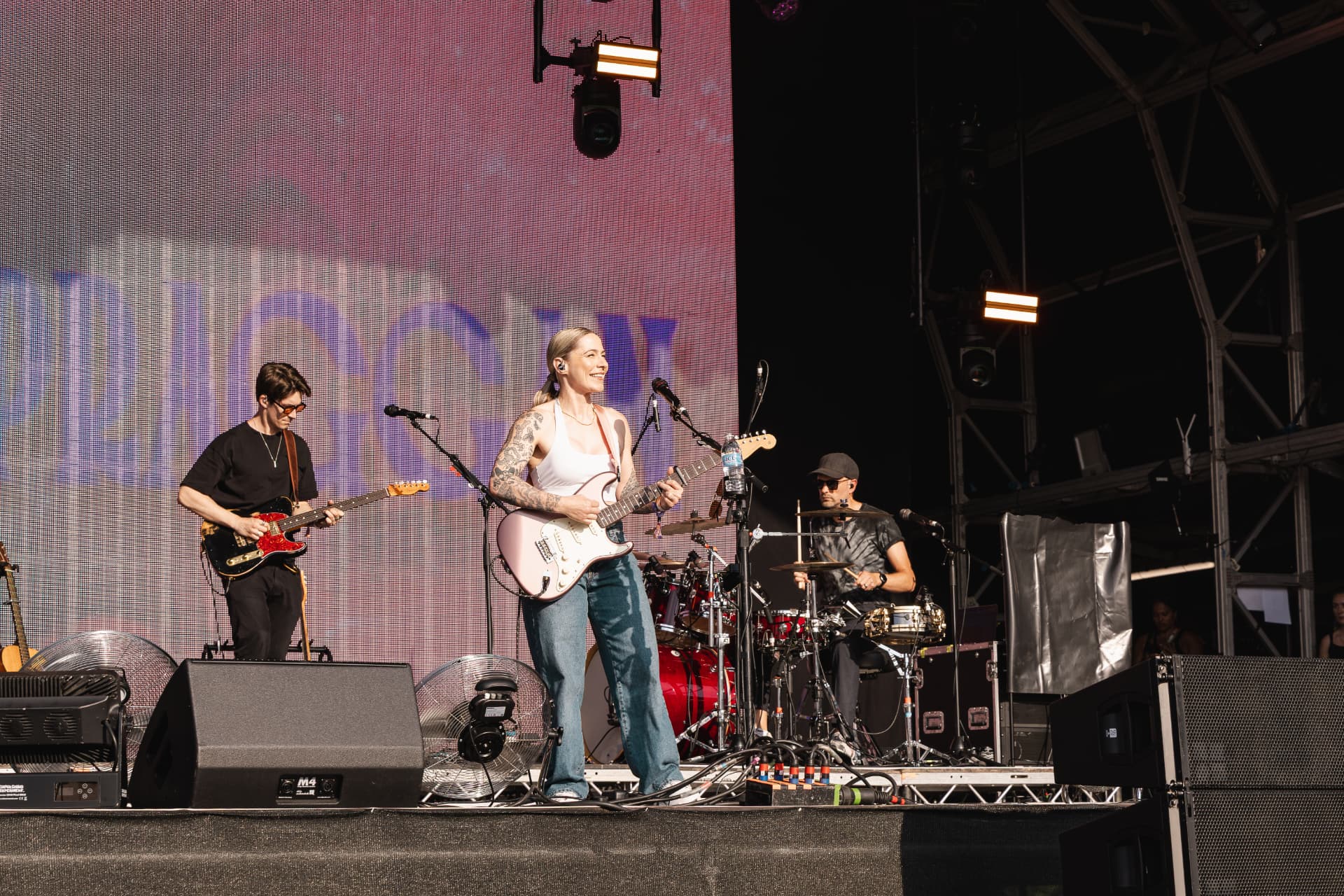Full band performing on the festival stage