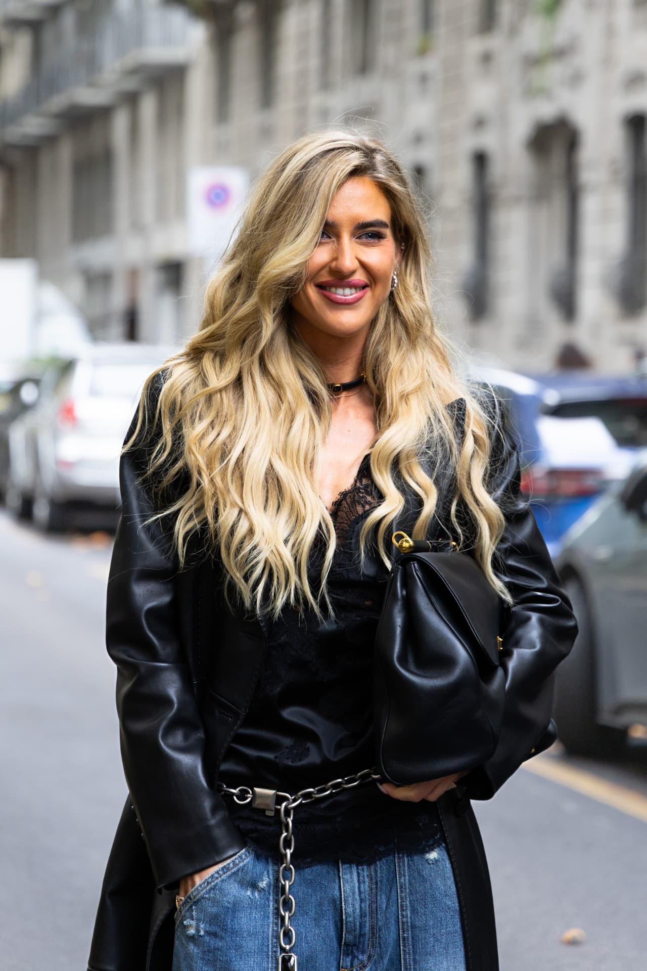 Guest in black leather jacket, lace top and chain belt