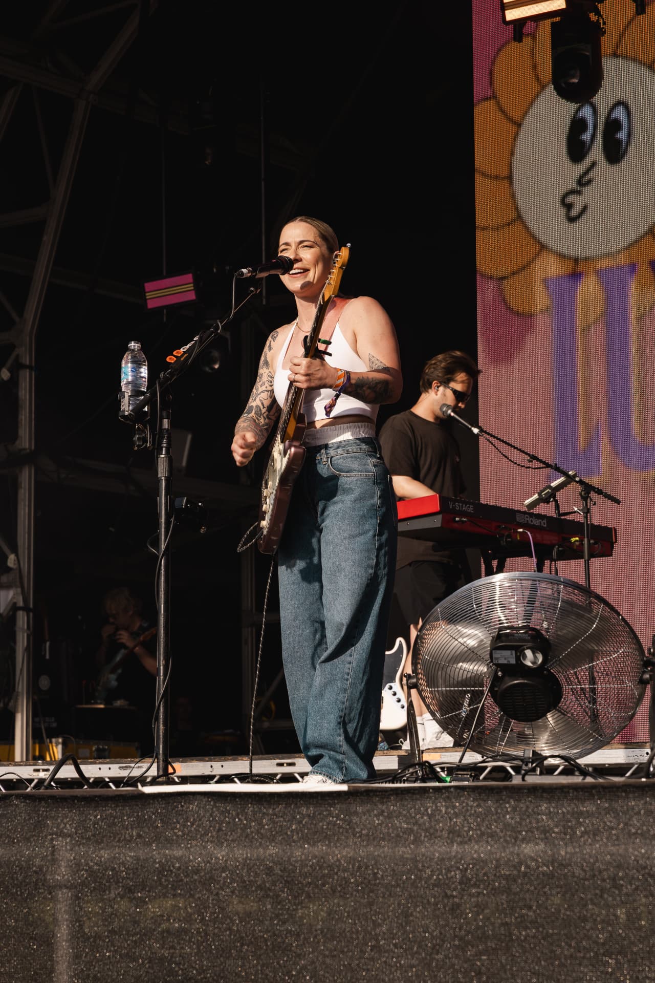 Singing into the mic with the band behind
