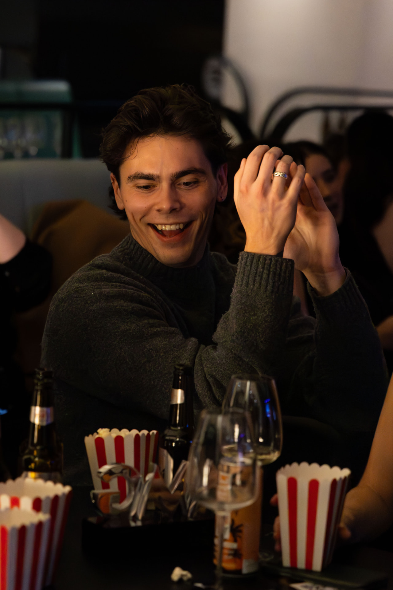 Guest applauding at a table during the awards