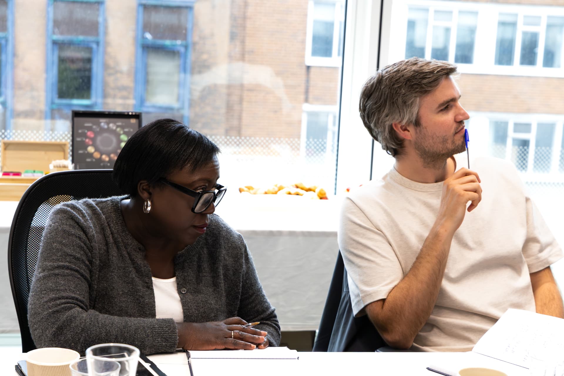 Judges listening intently at the judging table