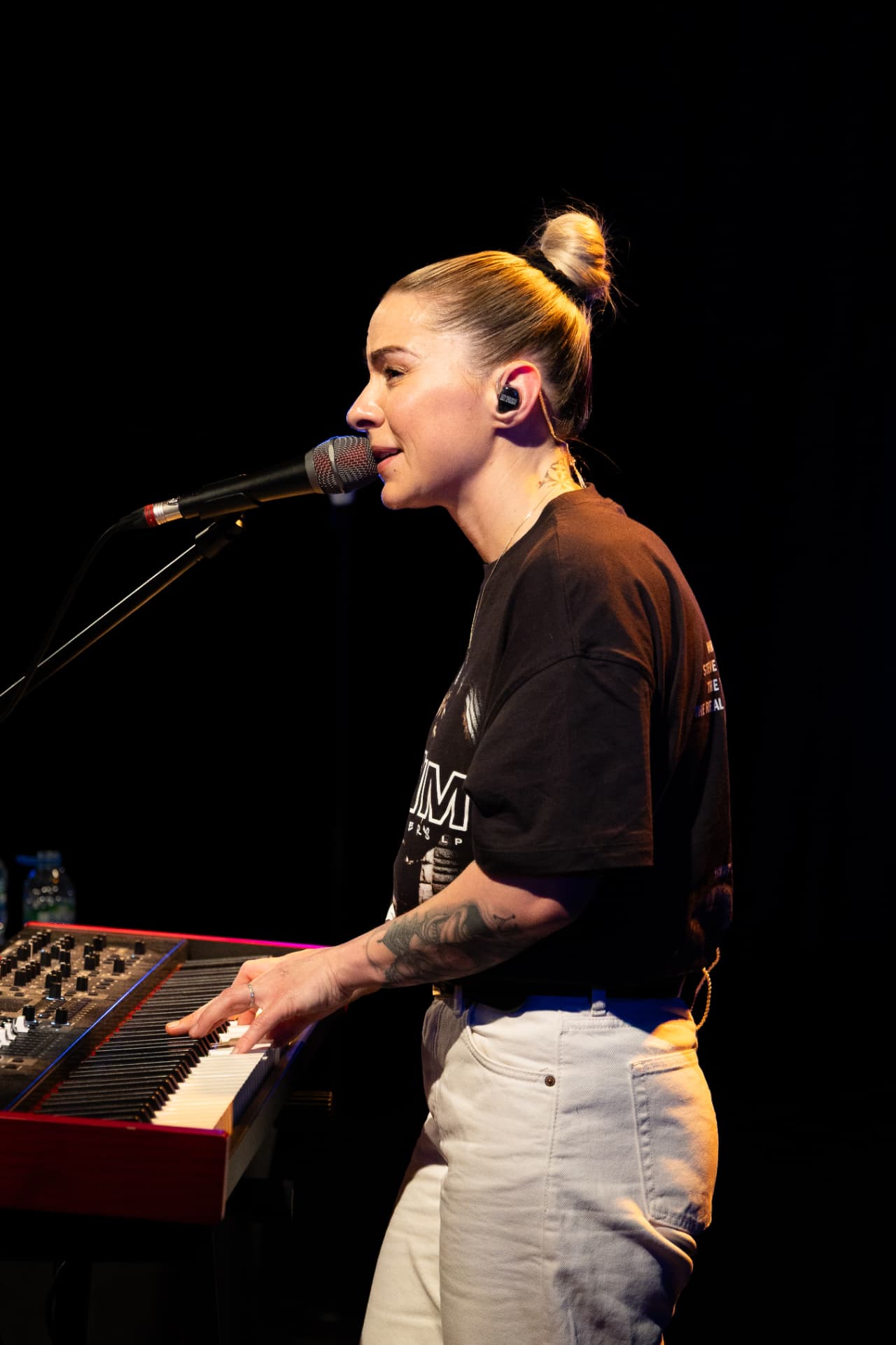 Side profile singing at the keyboard